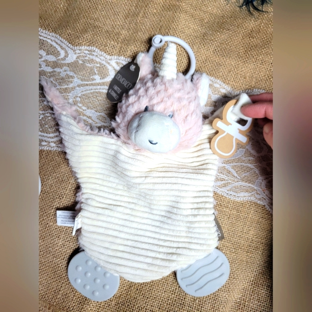 Demdaco unicorn pacifier holder that rattles crinkles